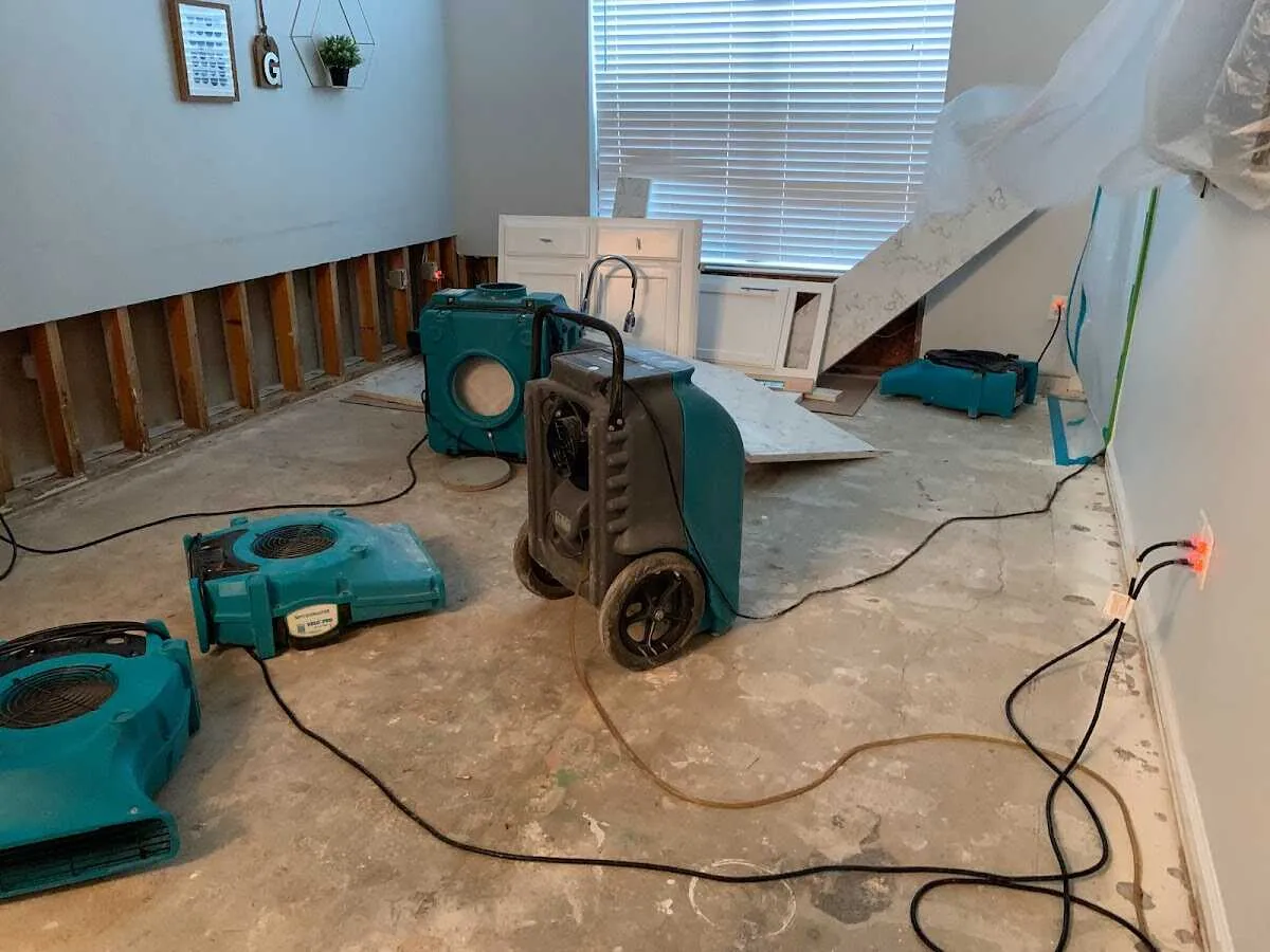 Dehumidifier in flood-cut room for Water Damage Restoration in Dixon